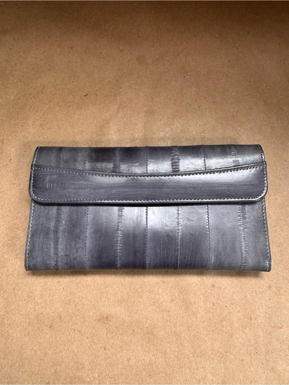 Vintage Grey Eelskin Folded Wallet. 7” by 4” by 0.5”
